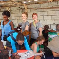 Madalyn Slubowksi, Anna Vander Boon, and MacKenzie Kraft helping build and distribute water filters near Borel, Haiti